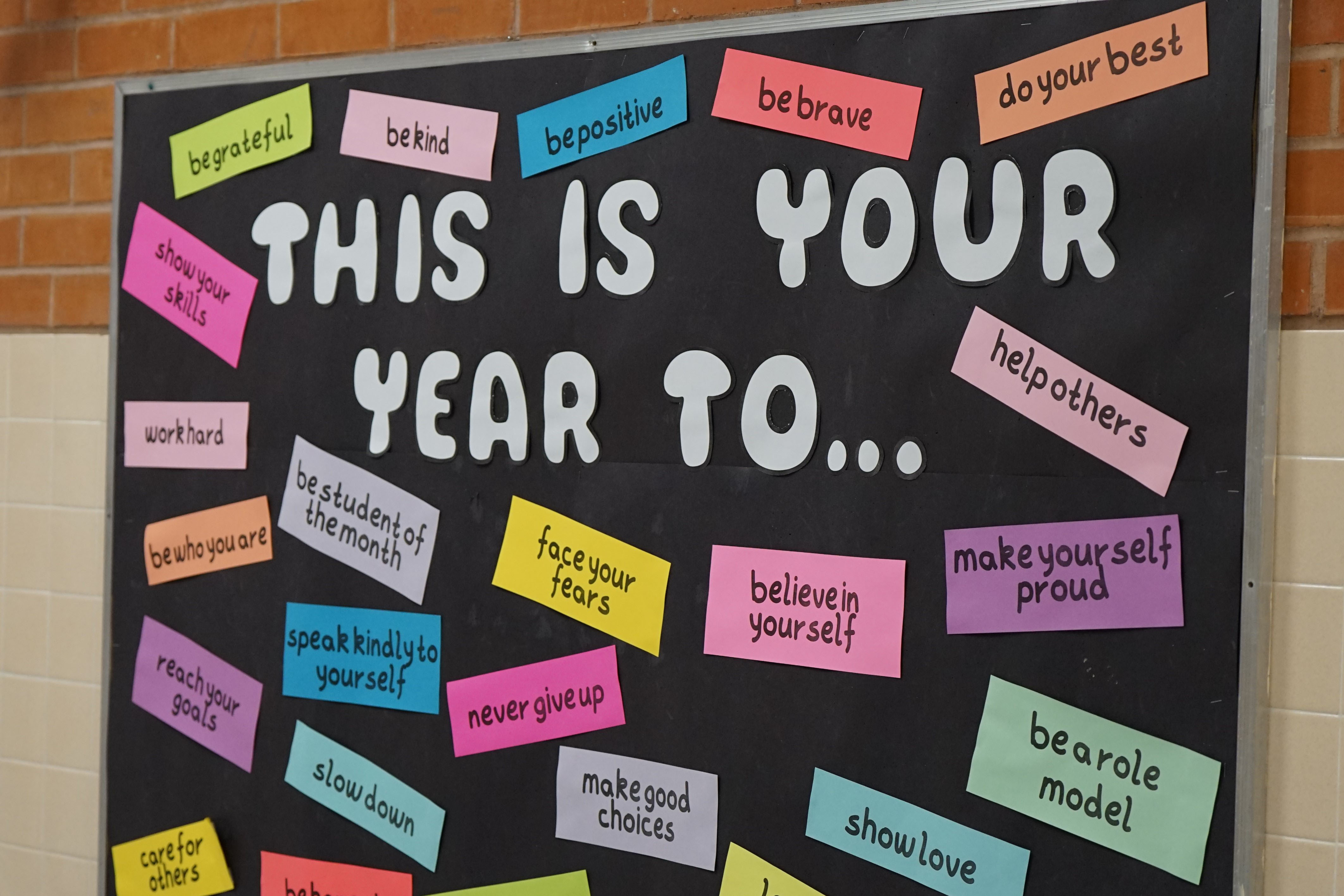 A billboard with the word This Is Your Year To... and mantras for students to follow